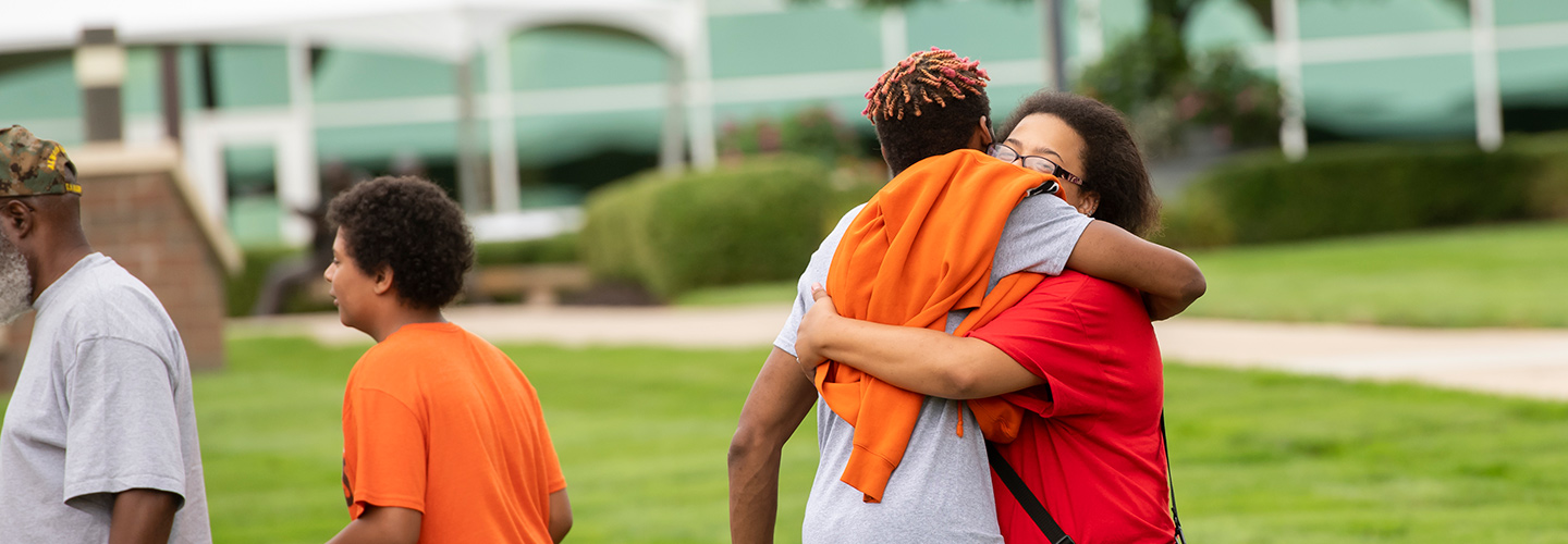 Students on campus with families