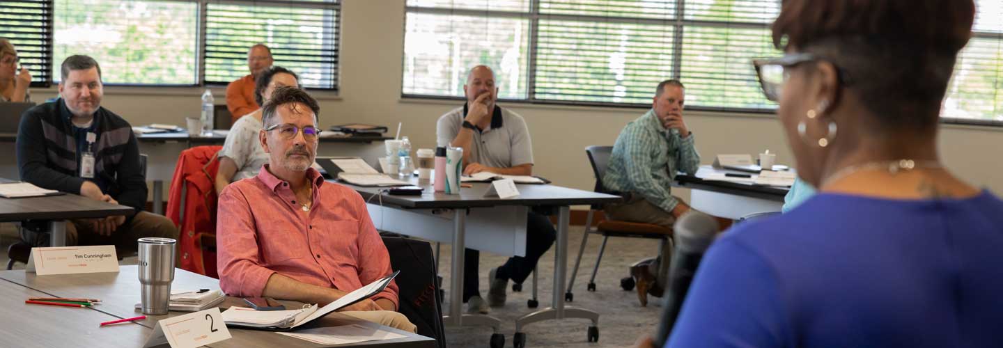 Business people attending a CLI training