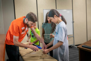 Working on a rubber band car