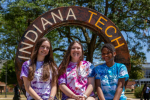 Students in front of the Indiana Tech water wheel
