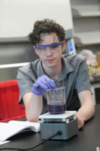 Student working at a beaker