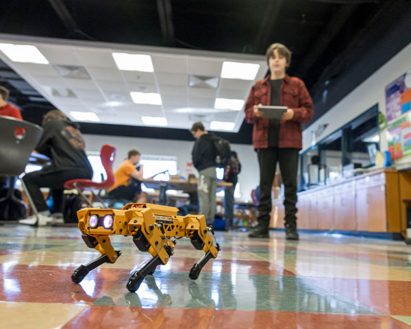 Student piloting a robot