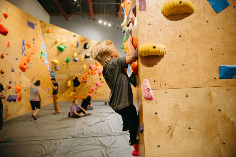 Child climbing at Summit City Climbing Co