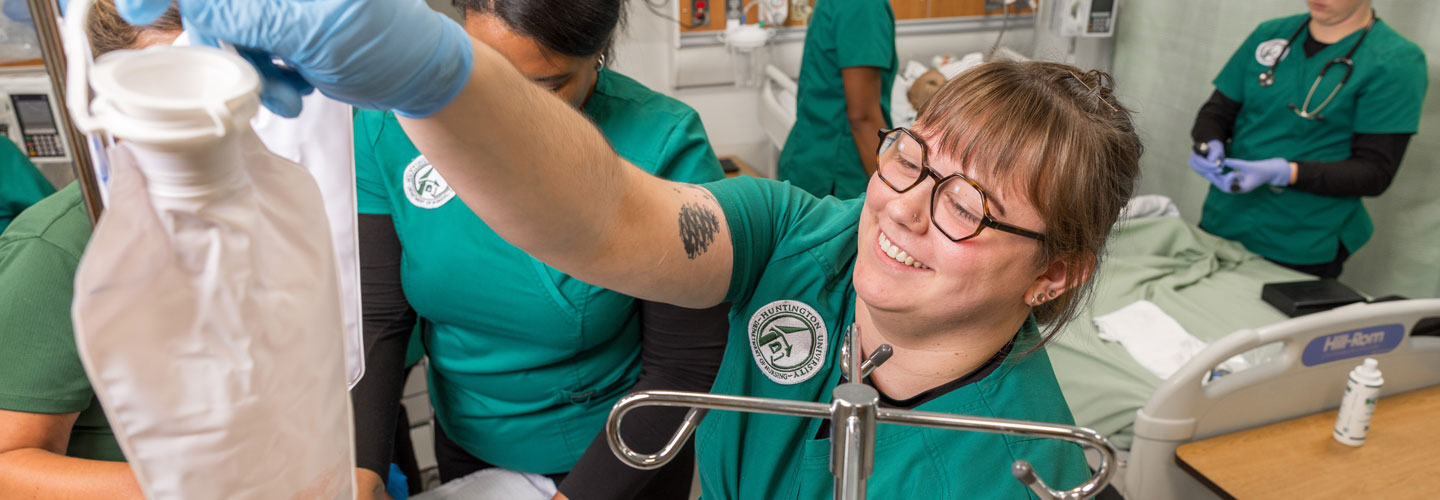 Nursing students setting up an IV