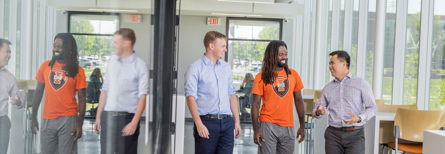 Lewis Roberts, Sam Bodley, and Dr. Thomas Tran walking in the Zollner Engineering Center