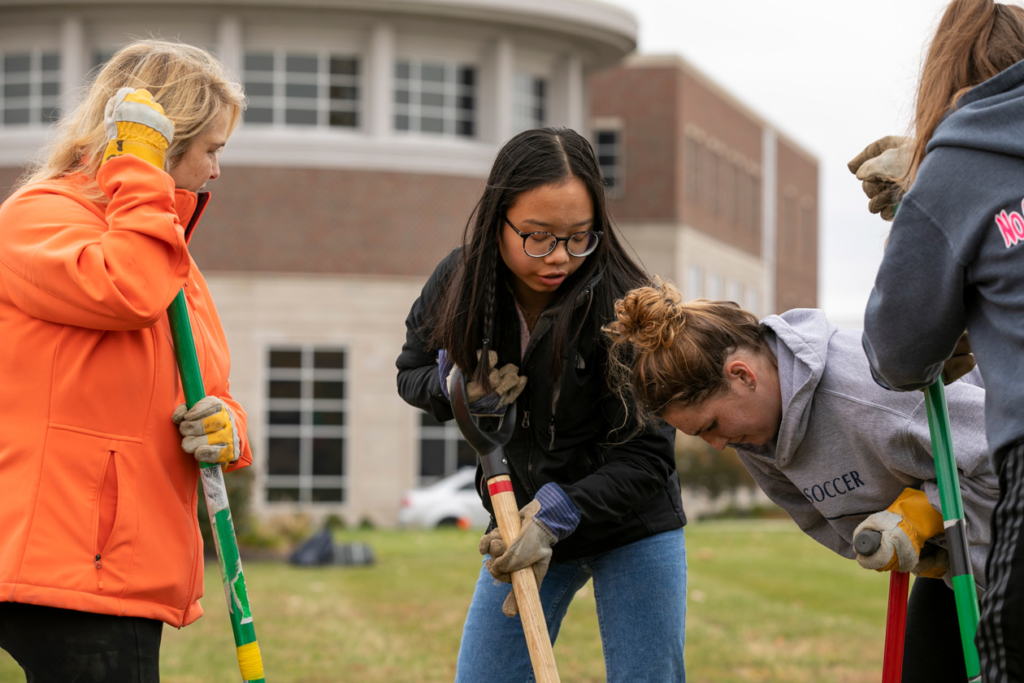 Indiana Tech Students from the Green Team advocating sustainability by planting trees on campus