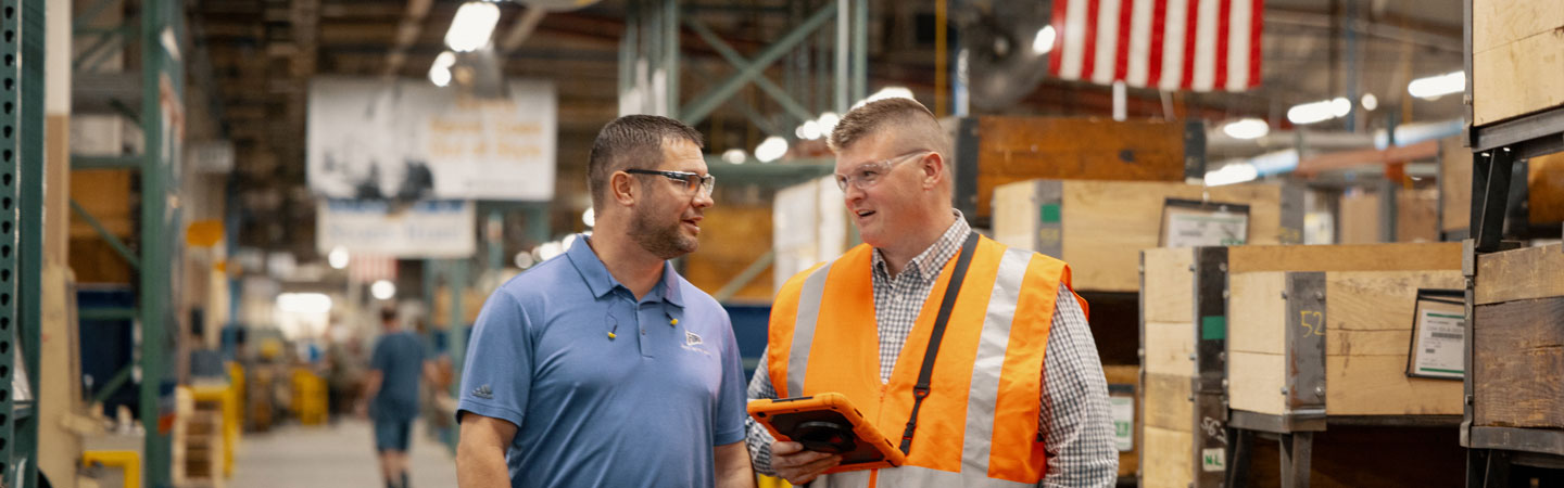 Graduate Clayton Dimmit in a warehouse