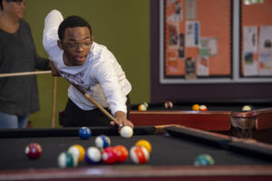 Student playing pool