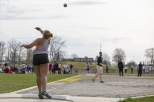 Indiana Tech student athlete throwing a shot put