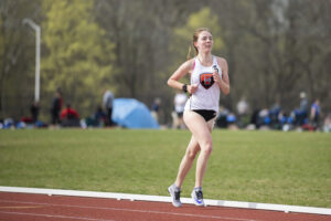 Indiana Tech student athlete running on the Warrior Park outdoor track