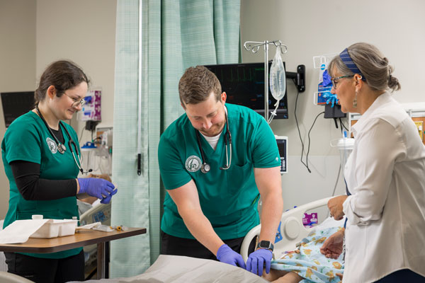 Nursing students doing hands-on learning