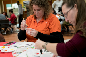 Faculty and staff painting hope rocks