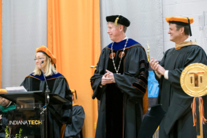 Honor guests and Board of Trustees members congratulating former President Arthur Snyder during President Karl W. Einolf's inauguration