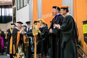 Honor guests and Board of Trustees members congratulating former President Arthur Snyder during President Karl W. Einolf's inauguration