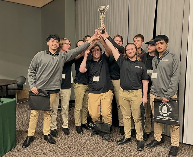 members of the 2023-24 Indiana Tech Cyber Warriors holding trophy