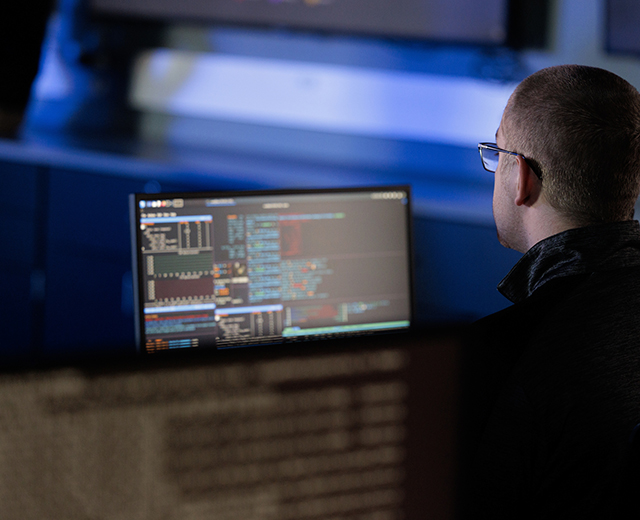 cybersecurity student at a computer