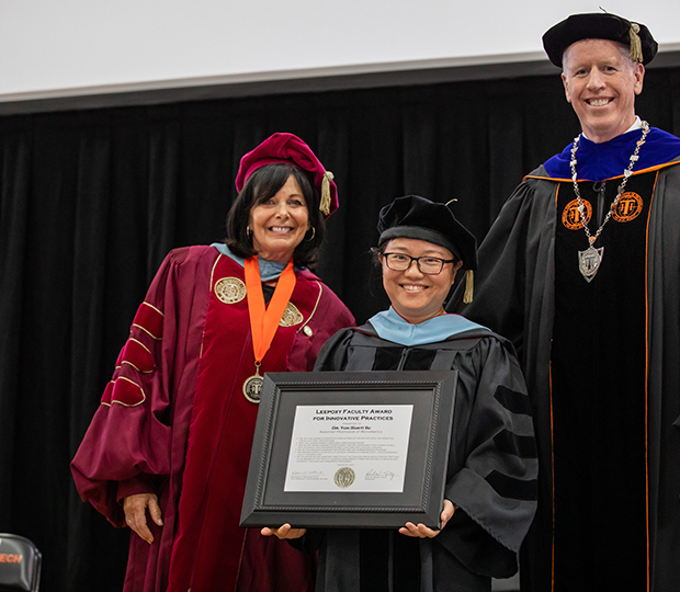 dr. su leepoxy from left to right, VPAA Dr. Katherine Watland, Dr. Yun Su and President Karl Einolf