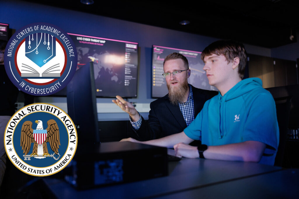 cybersecurity professor Matt Hansen, left, and a student