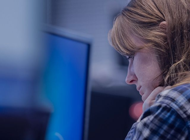 Student working in a computer lab on campus