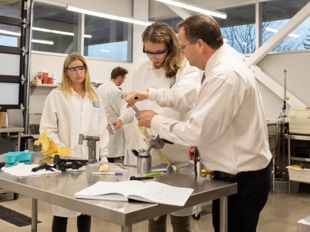 Professor Phlipot instructing students on installing bone implants
