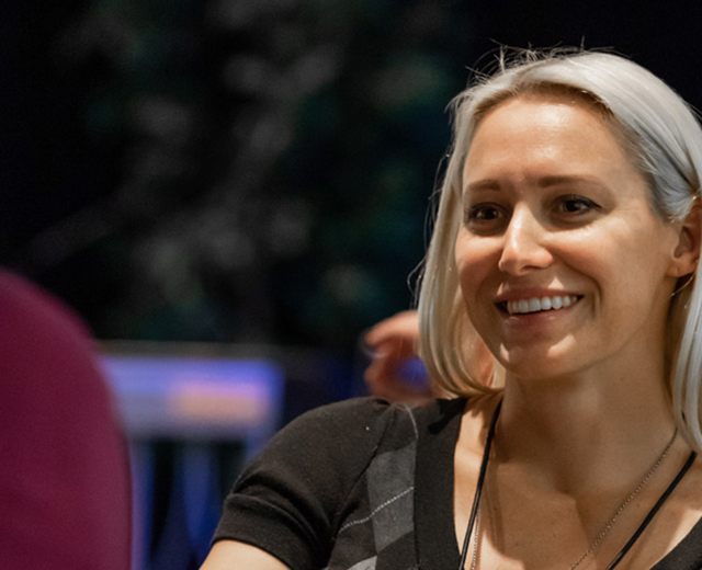 photo of a woman attending a conference