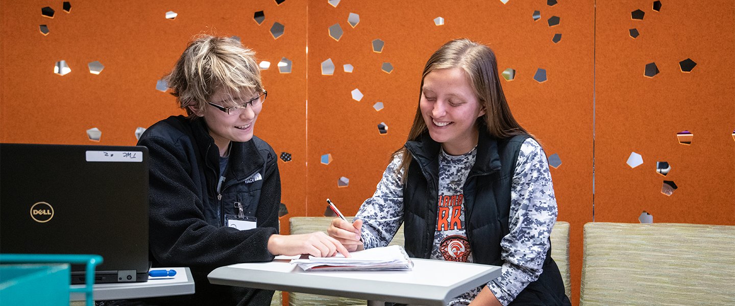 Students collaborating on a paper